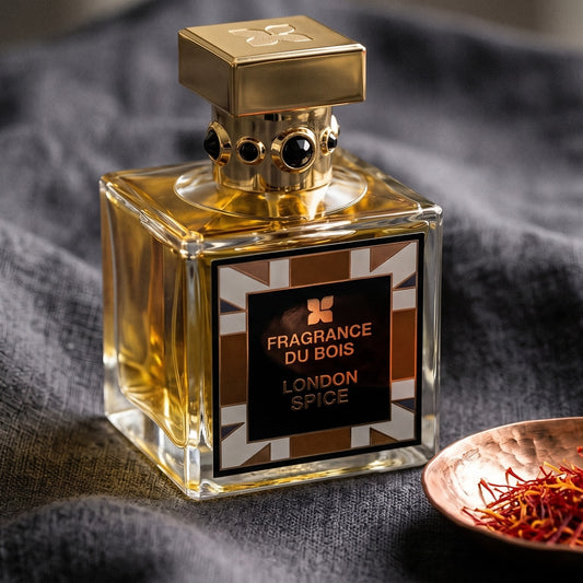 Fragrance Du Bois London Spice on charcoal linen with a small copper bowl of saffron threads