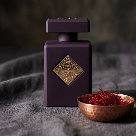 Initio Narcotic Delight EDP on charcoal linen with a small copper bowl of saffron threads