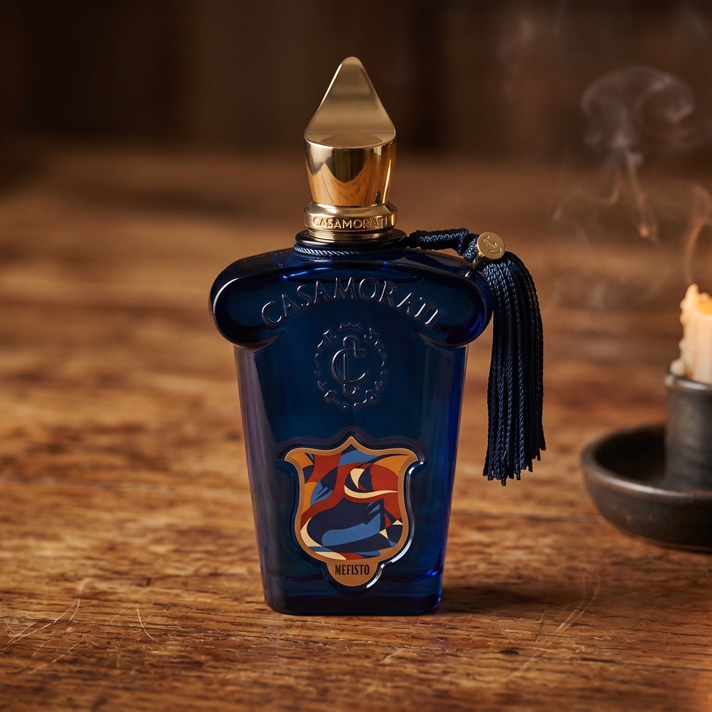 Xerjoff Casamorati Mefisto EDP on aged teak with a candle burning gently to frame-right