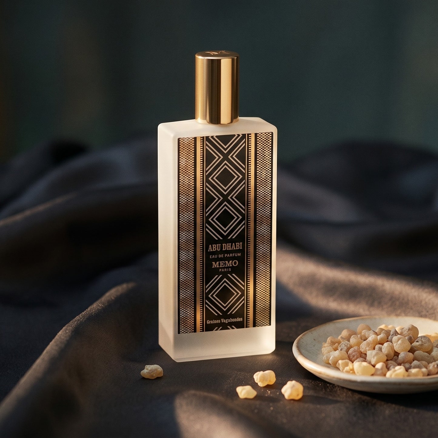Memo Paris Abu Dhabi EDP on charcoal silk with frankincense resin granules in a small saucer