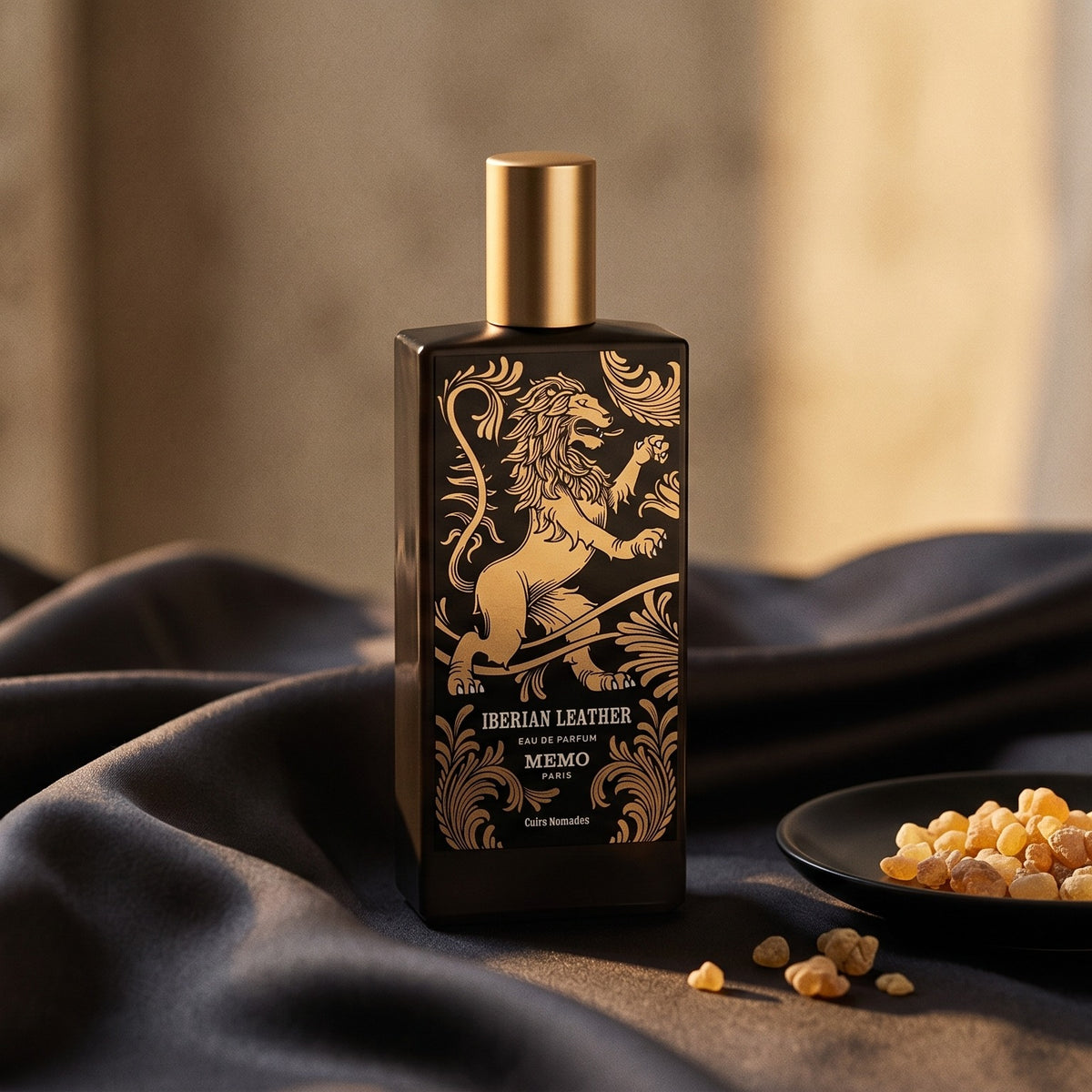 Memo Paris Iberian Leather EDP on charcoal silk with frankincense resin granules in a small saucer