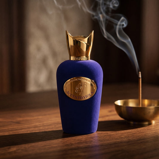 Sospiro Accento Viola EDP on dark walnut console with a small brass incense bowl with smoke curling upward