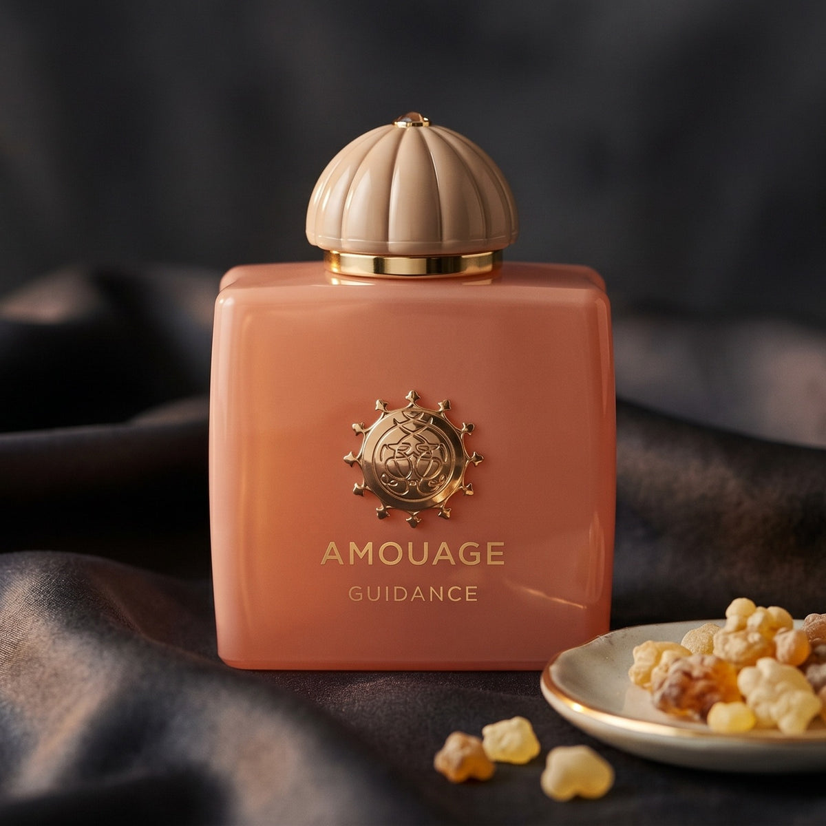 Amouage Guidance on onyx linen with dried rose petals and resin drops intermixed