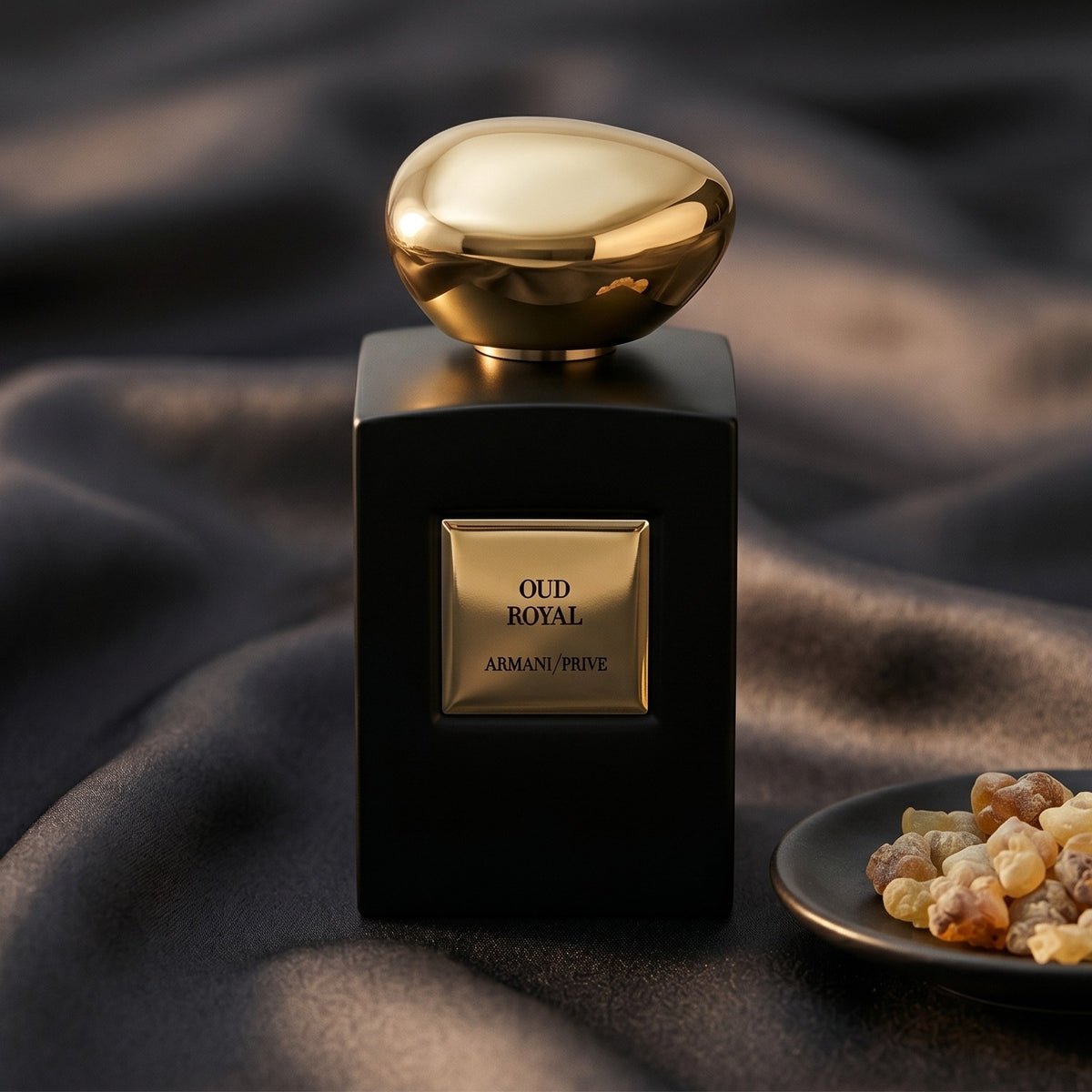 Armani/Prive Royal Oud EDP on charcoal silk with frankincense resin granules in a small saucer