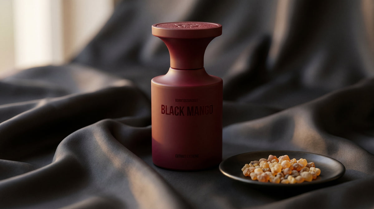 Borntostandout Black Mango Extrait Extreme on charcoal silk with frankincense resin granules in a small saucer