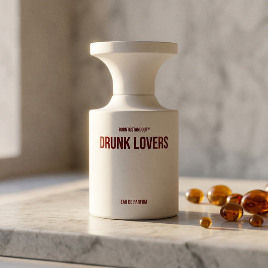 Borntostandout Drunk Lovers EDP on polished limestone with benzoin resin pebbles arranged loosely
