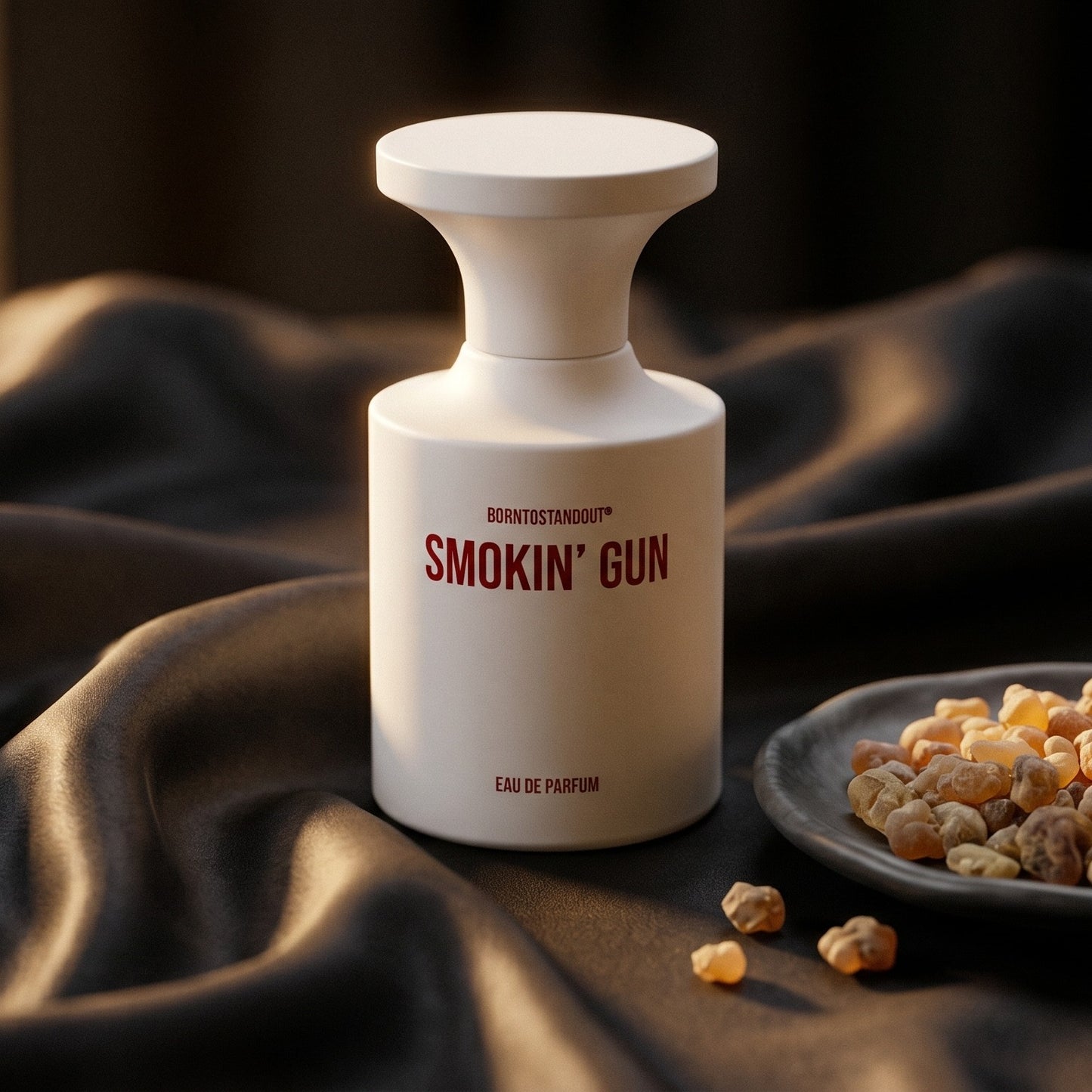 Borntostandout Smokin Gun EDP on charcoal silk with frankincense resin granules in a small saucer