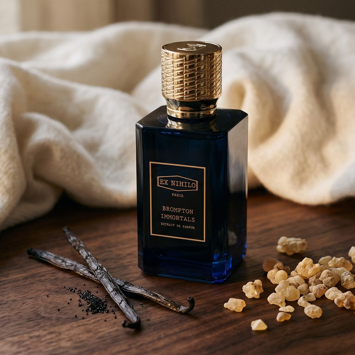 Ex Nihilo Brompton Immortals Extrait de Parfum on dark walnut wood with vanilla pods, olibanum resin and cashmere
