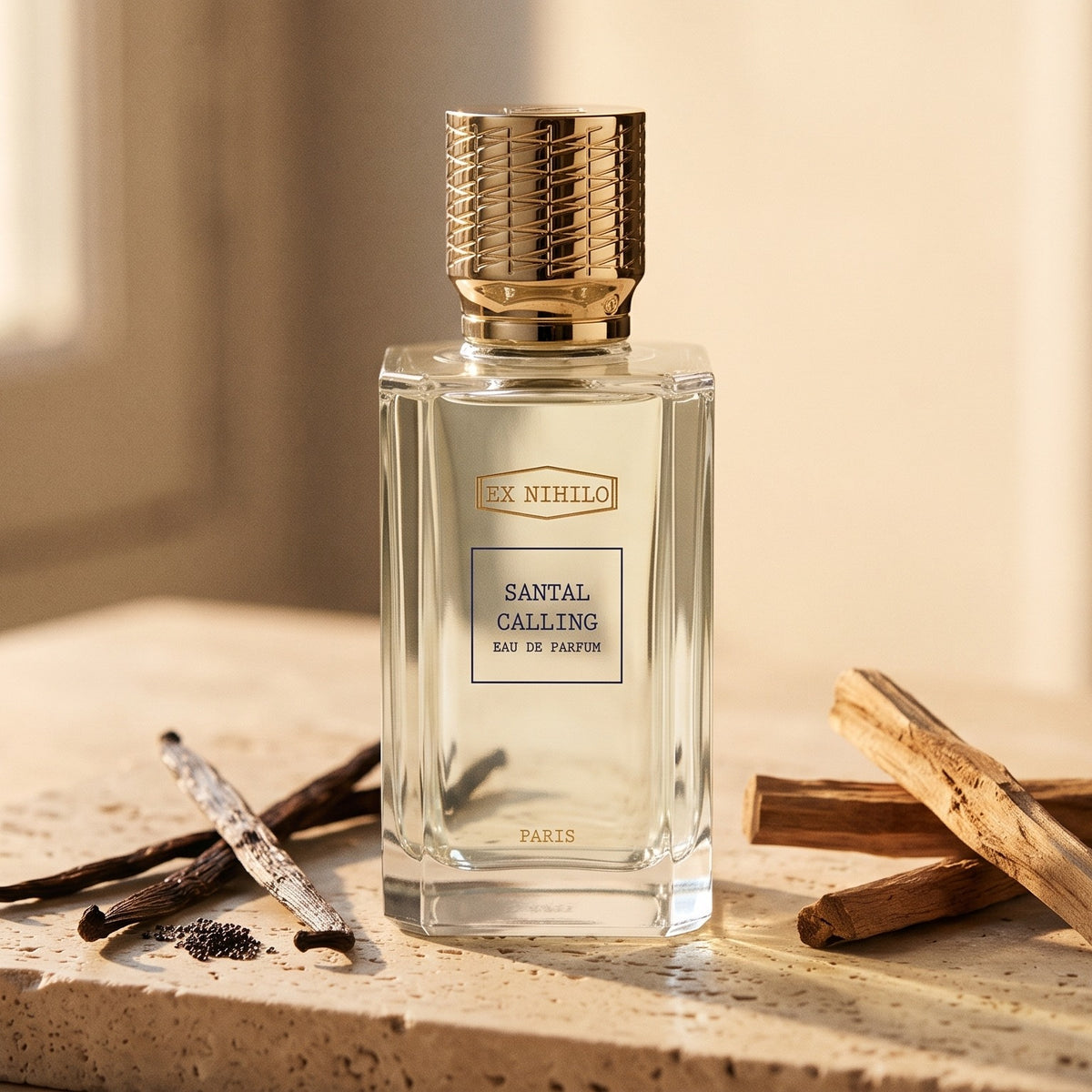 Ex Nihilo Santal Calling EDP on warm beige travertine with sandalwood sticks and vanilla pods