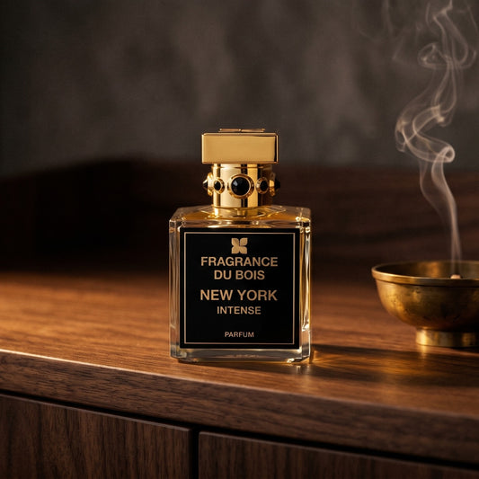 Fragrance du Bois NY Intense on smoked-glass tabletop with a lacquered incense burner in mid-glow