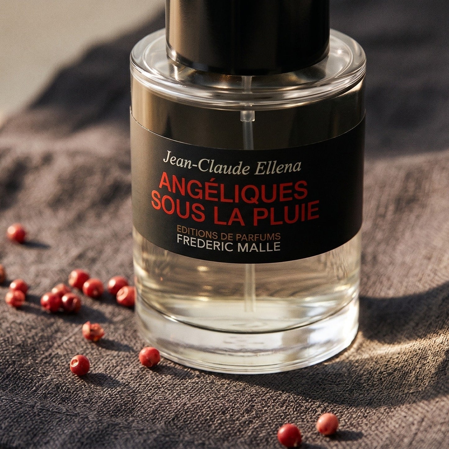 Frederic Malle Angeliques Sous La Pluie EDT on charcoal linen with pink peppercorns