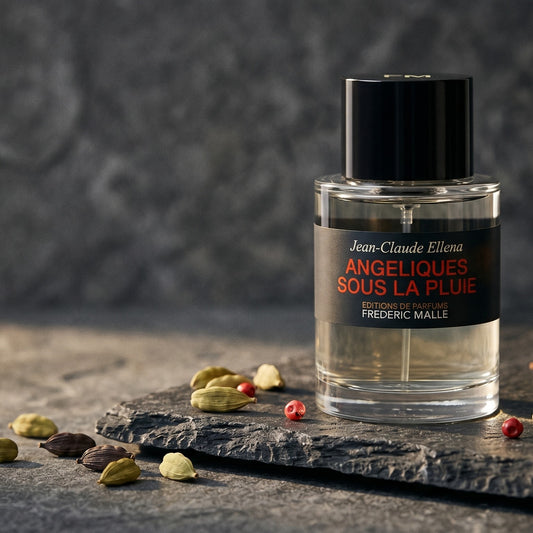 Frederic Malle Angeliques Sous La Pluie EDT on deep grey travertine with a scatter of nutmeg and allspice