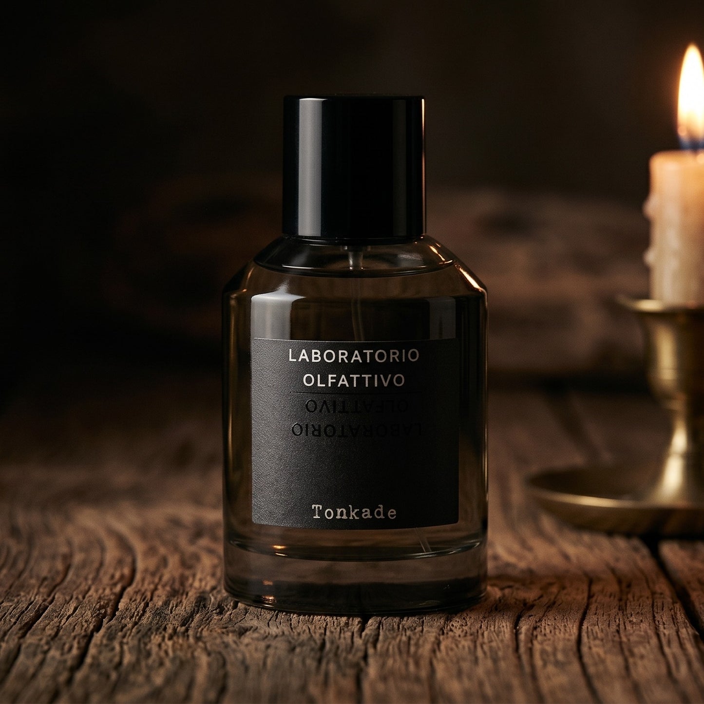 Laboratorio Olfattivo Tonkade on aged maple with a slender candlestick and drifting smoke