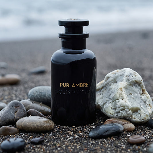 Louis Vuitton Pur Ambre - Pure Perfumes on wet dark sand with ambergris and sea pebbles