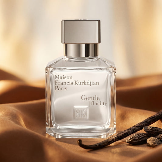 Maison Francis Kurkdjian (MFK) Gentle Fluidity Silver on warm caramel silk with a vanilla pod and tonka bean beside the bo…