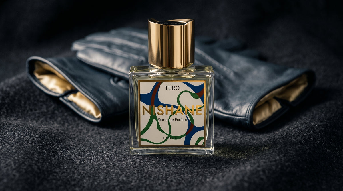 Nishane Tero EDP on charcoal felt with a silk-lined glove just behind the bottle