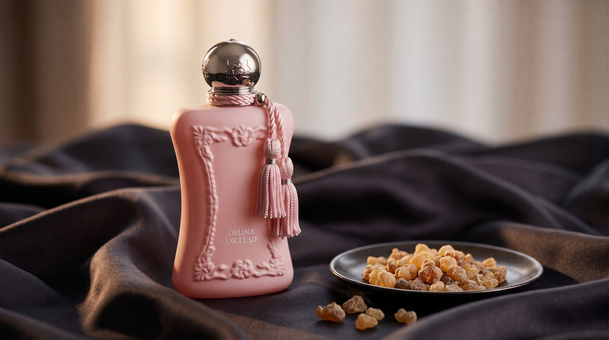 Parfums de Marly Delina Exclusif Parfum on charcoal silk with frankincense resin granules in a small saucer