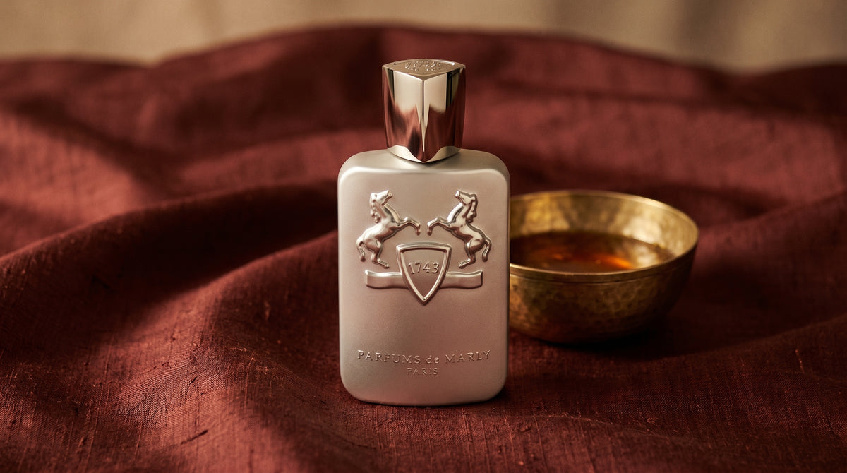 Parfums de Marly Pegasus on raw silk of oxblood color with a brass bowl with ambergris tincture