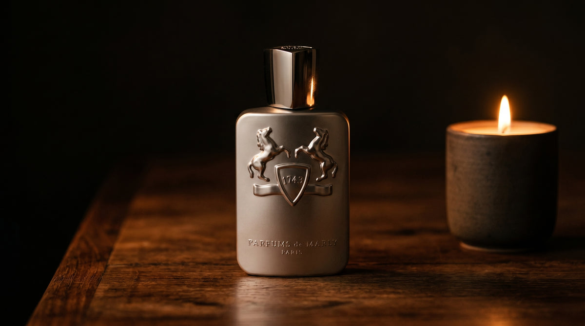 Parfums de Marly Pegasus on aged teak with a candle burning gently to frame-right