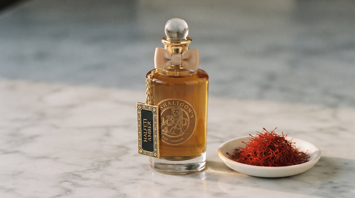 Penhaligon's Halfeti Amber EDP - Dubai Exclusive on pale grey marble with a small white ceramic dish of crimson saffron threads