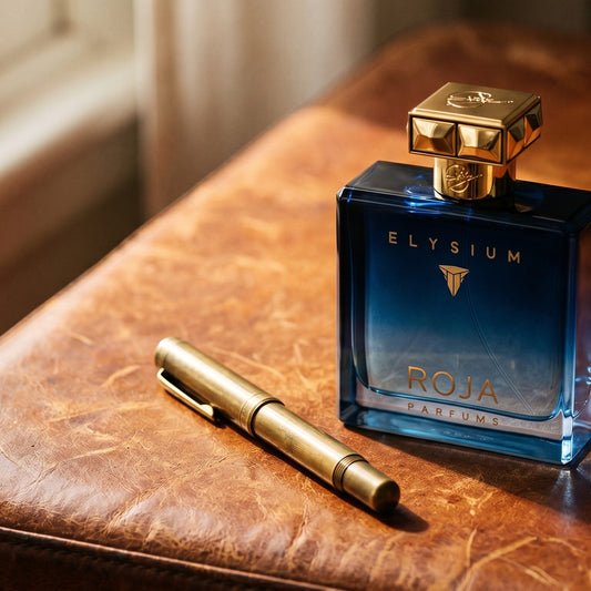 Roja Elysium Parfum Cologne on cordovan leather surface with a small brass key beside the bottle