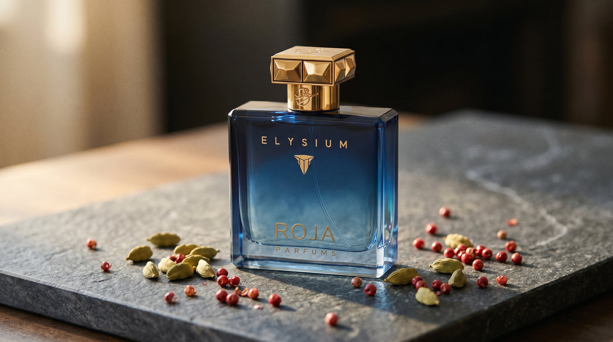 Roja Elysium Pour Femme EDP on dark grey stone slab with cardamom pods and pink peppercorns scattered