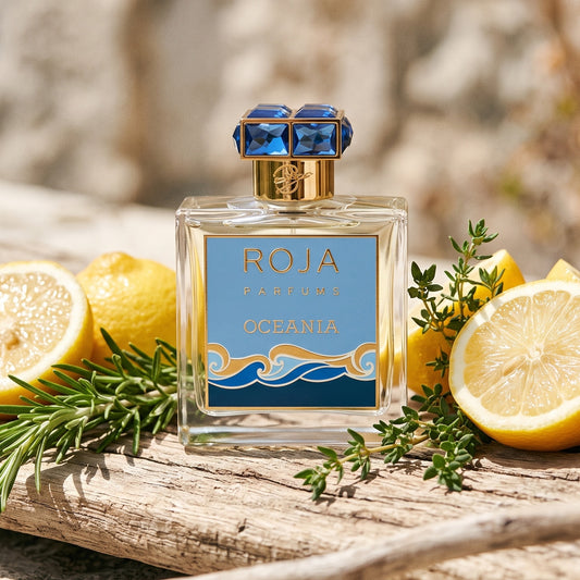 Roja Oceania EDP on sun-bleached driftwood with halved lemons, rosemary and thyme sprigs