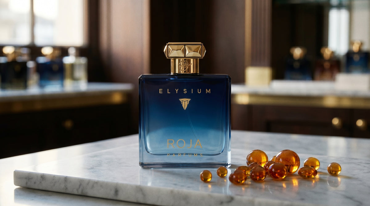 Roja Scandal Pour Homme Parfum on pale grey marble with amber resin beads scattered to one side
