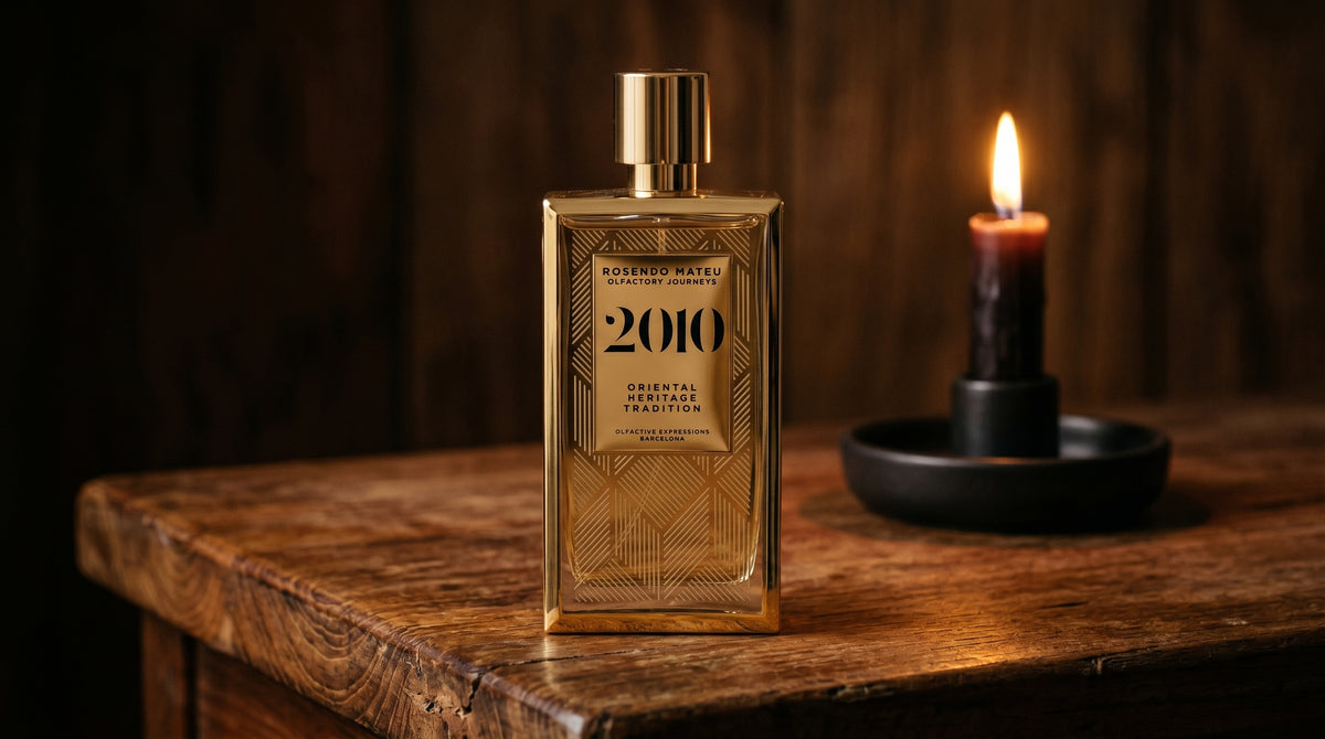 Rosendo Mateu 2010 EDP on aged teak with a candle burning gently to frame-right