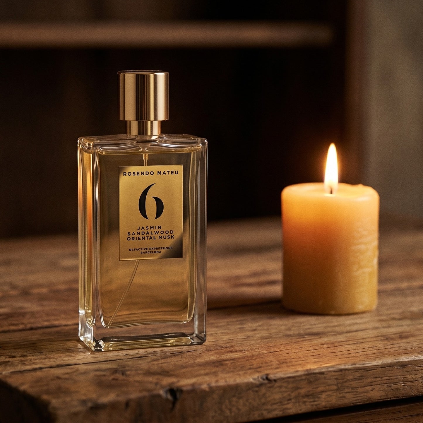 Rosendo Mateu No. 6 EDP on rosewood surface with a squat brass candle flickering nearby