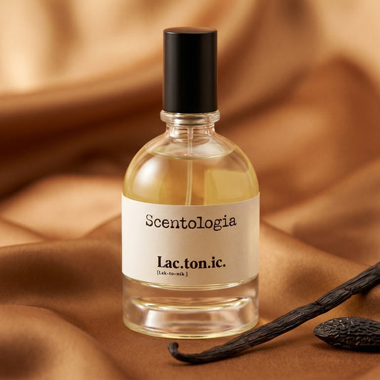 Scentologia Lactonic EDP on butter-yellow raw silk with a pair of tonka beans nearby