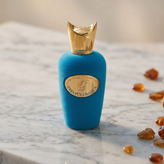 Sospiro Erba Pura Magica on warm ivory travertine with labdanum chunks clustered by the base