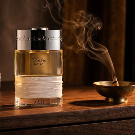 The Spirit of Dubai Bahar on dark walnut console with a small brass incense bowl, smoke curling upward
