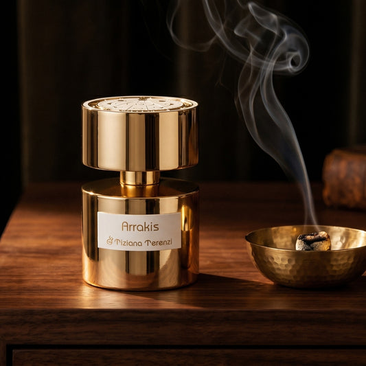 Tiziana Terenzi Arrakis Extrait de Perfume on ebony surface with a hammered copper censer releasing frankincense haze