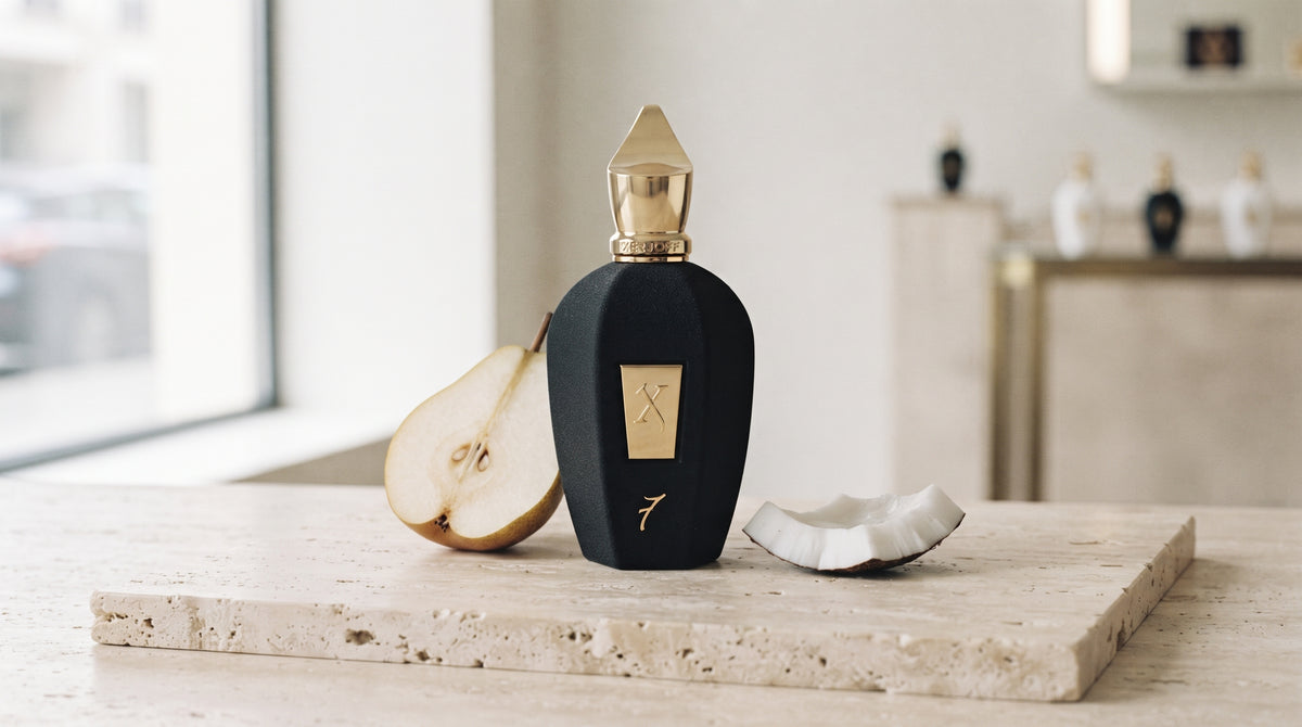 Xerjoff 7 Seven Black Flacon Parfum - UAE Exclusive Dubai Boutique Edition on pale travertine with a halved pear and a shard of fresh coconut