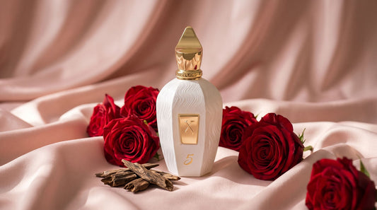 Xerjoff Five white UAE Exclusive bottle on blush pink silk with deep red roses and agarwood chips