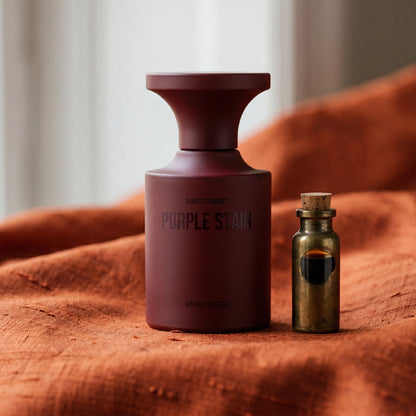 Borntostandout Purples Stain Extrait Extreme on burnt-orange raw silk with a brass vial of frankincense oil