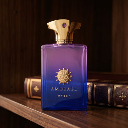 Amouage Myths Man on dark walnut library shelf with a leather-bound book with gold foil
