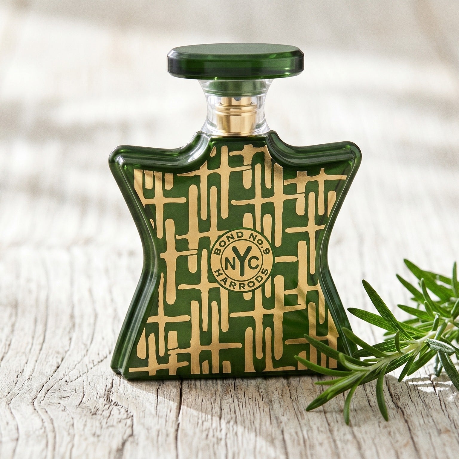 Bond No. 9 Harrods For Him EDP on pale weathered wood with a sprig of rosemary beside the bottle