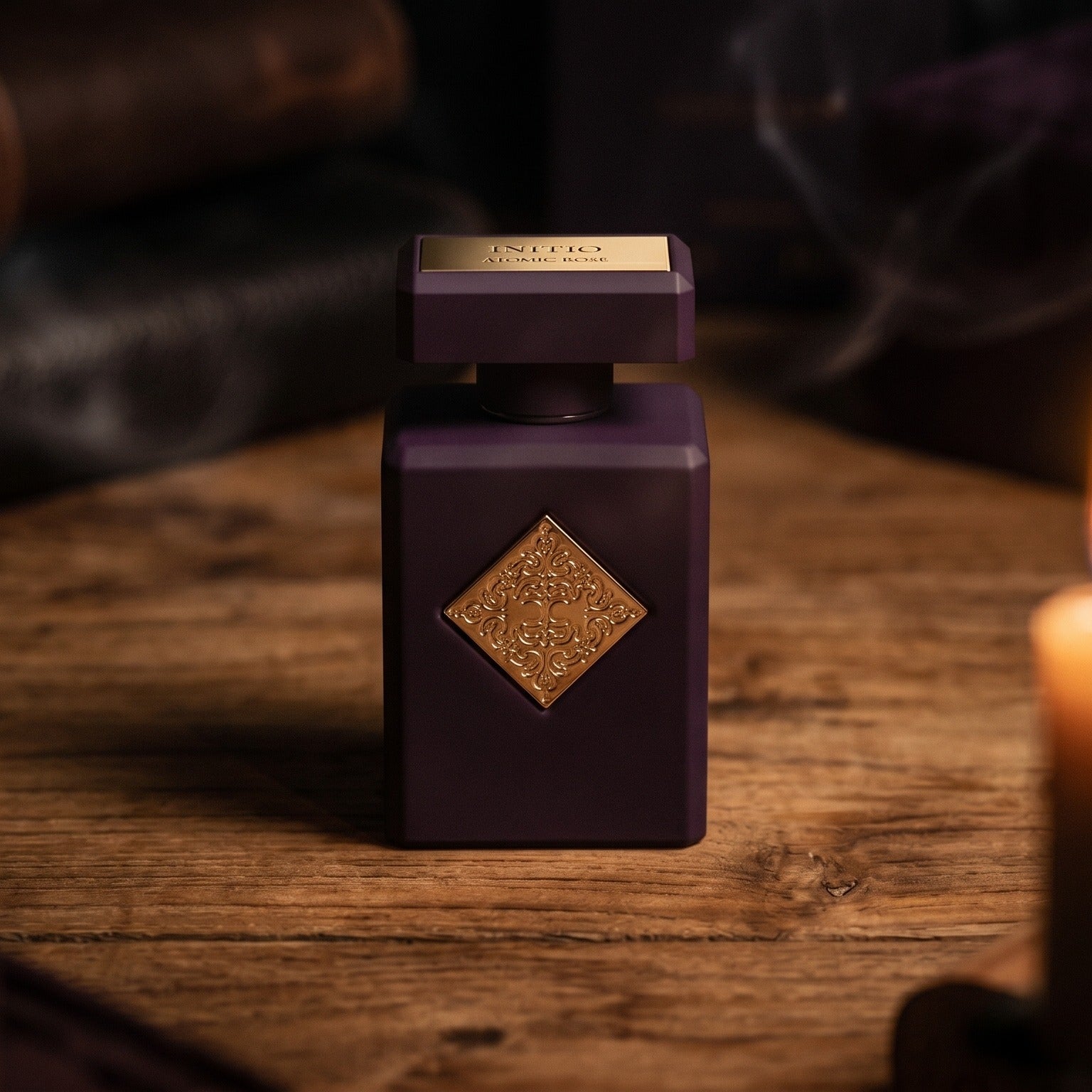 Initio Atomic Rose EDP on aged teak with a candle burning gently to frame-right