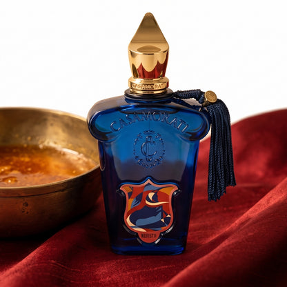 Xerjoff Casamorati Mefisto EDP on raw silk of oxblood color with a brass bowl with ambergris tincture