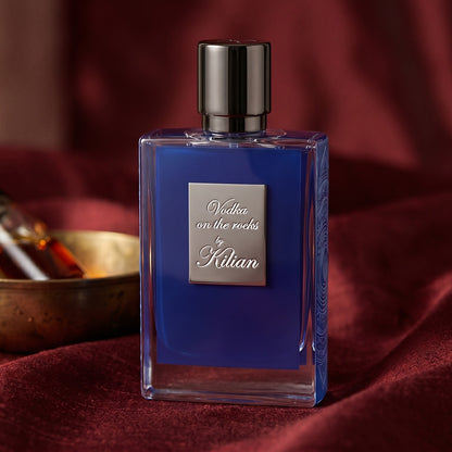 Kilian Vodka On The Rocks EDP on raw silk of oxblood color with a brass bowl with ambergris tincture