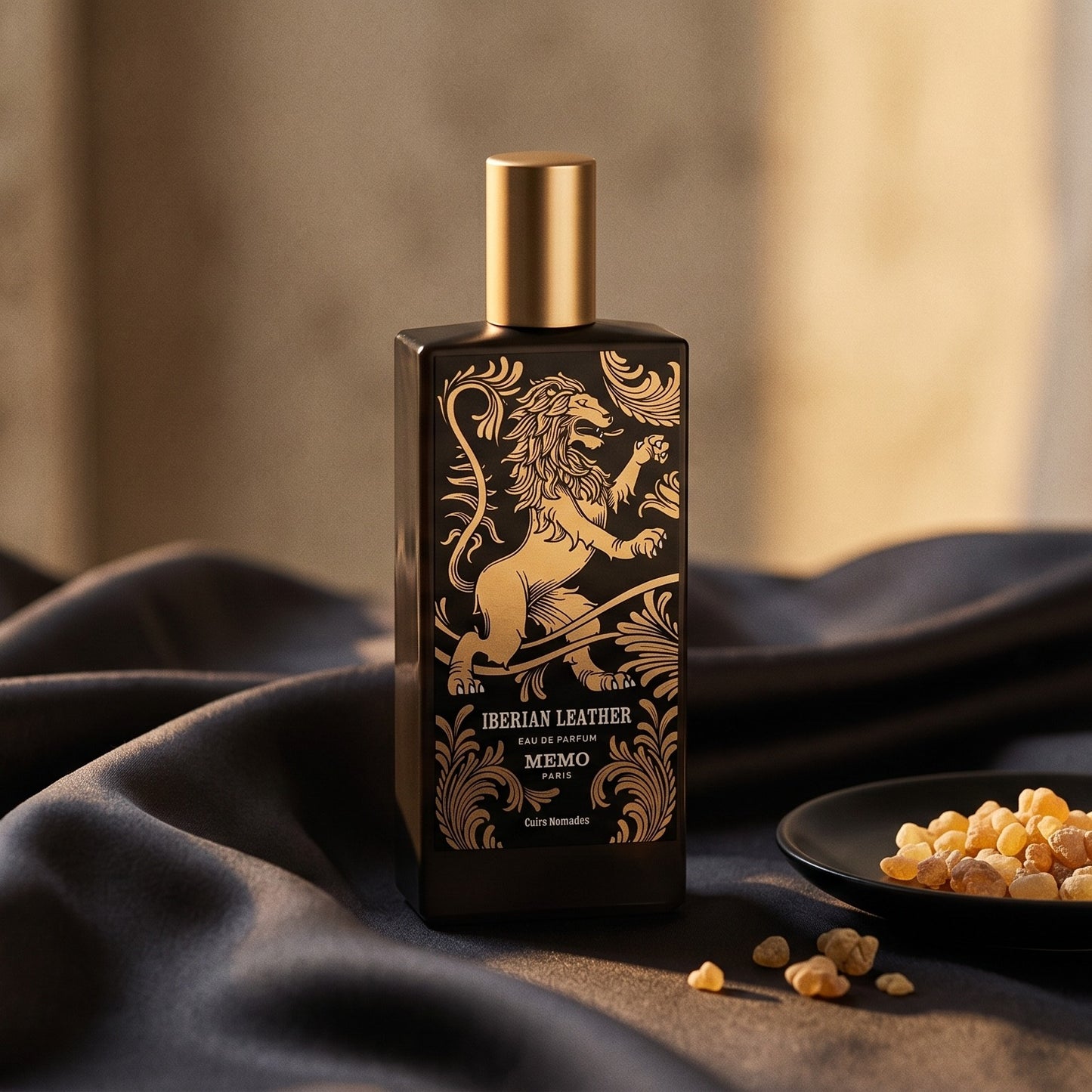 Memo Paris Iberian Leather EDP on charcoal silk with frankincense resin granules in a small saucer