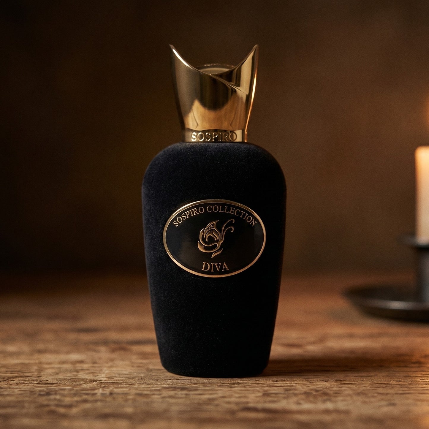 Sospiro Diva EDP on aged teak with a candle burning gently to frame-right