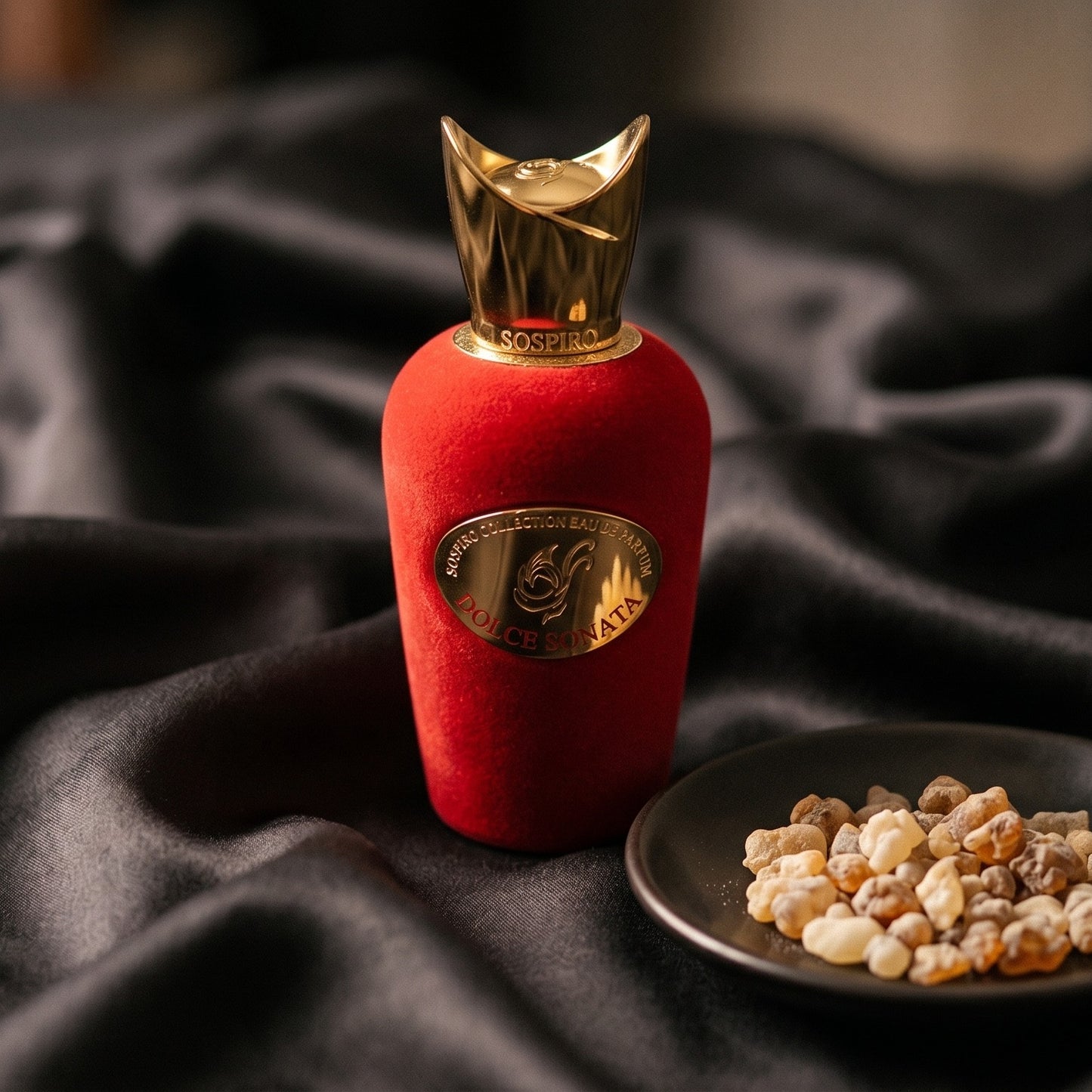 Sospiro Dolce Sonata EDP on charcoal silk with frankincense resin granules in a small saucer