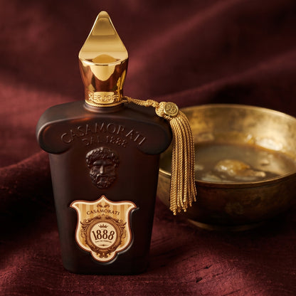 Xerjoff Casamorati 1888 EDP on raw silk of oxblood color with a brass bowl with ambergris tincture