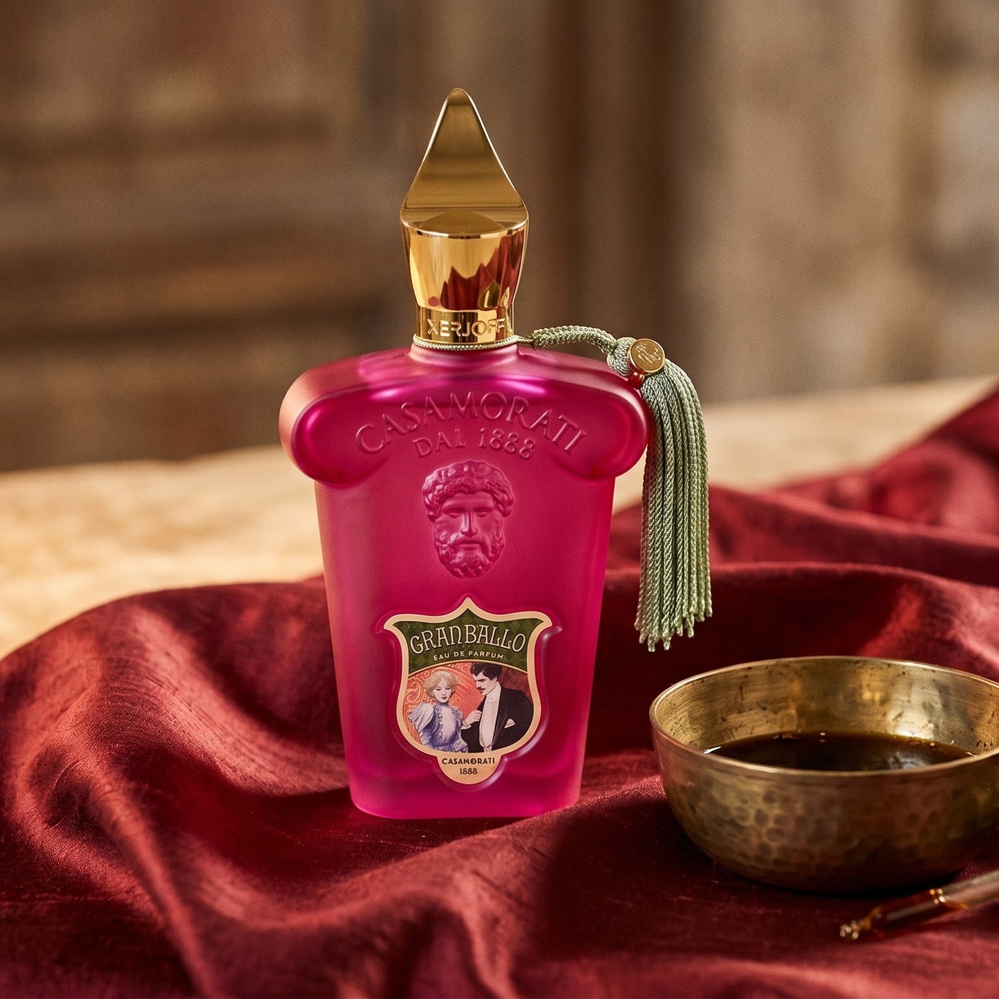 Xerjoff Gran Ballo EDP on raw silk of oxblood color with a brass bowl with ambergris tincture