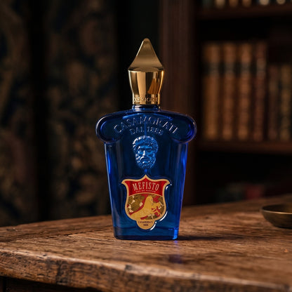 Xerjoff Mefisto EDP on aged teak with a candle burning gently to frame-right