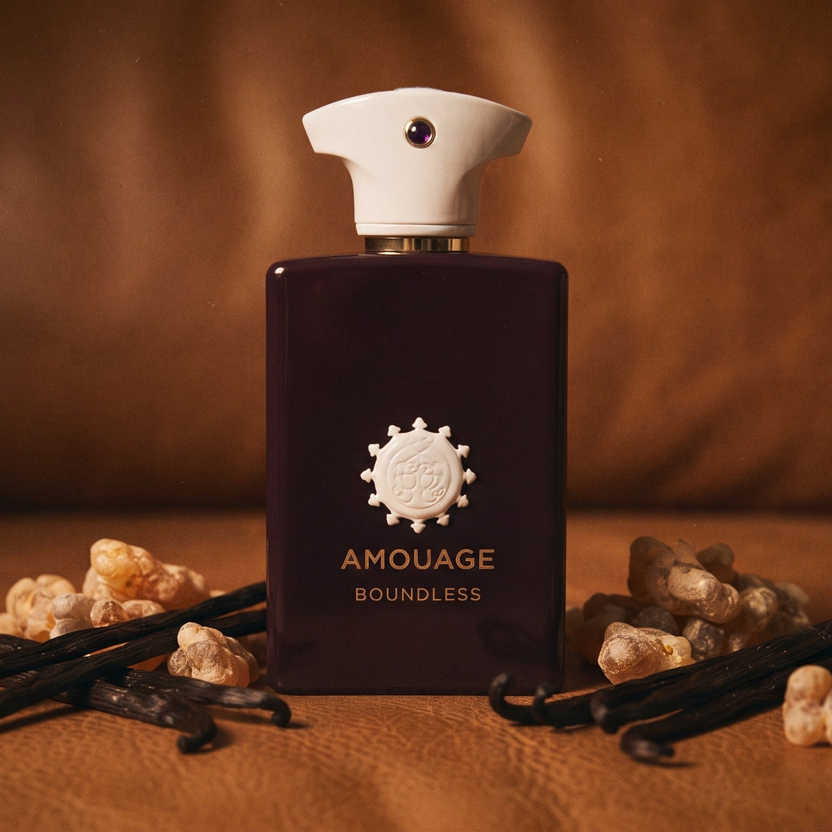 Amouage Boundless EDP on warm brown leather with vanilla pods and benzoin resin