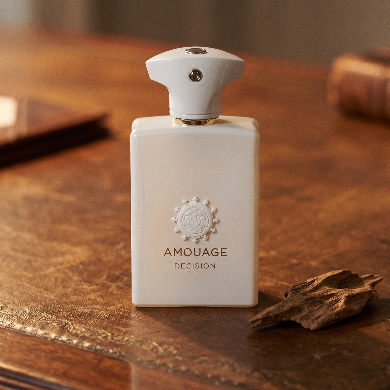 Amouage Decision EDP on aged library leather with a small stack of resinous wood splinters